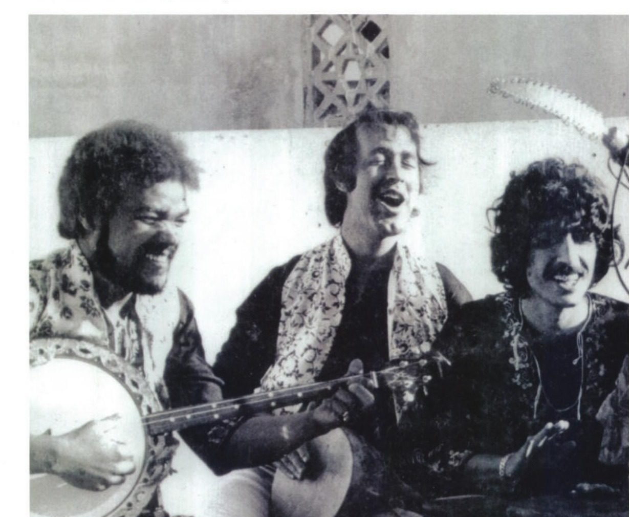 Three musicians playing a fretless banjo, derbouka and bendir