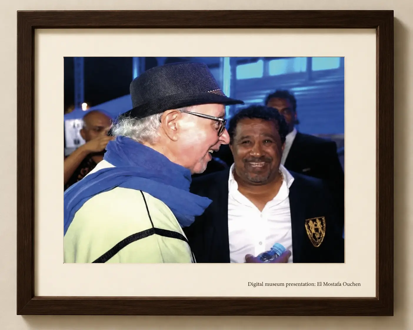 Omar Sayed greeting a performer at a public event