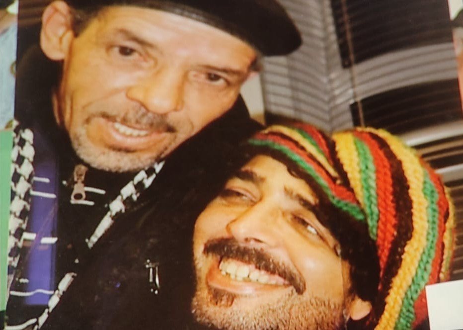 Omar Sayed sharing a warm moment with a friend