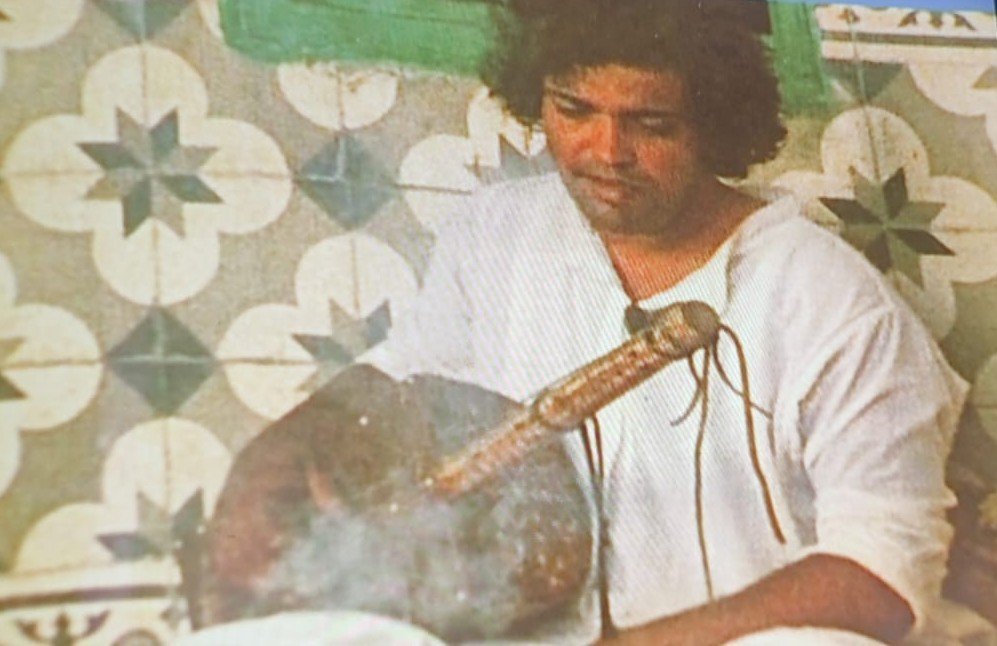 A Nass El Ghiwane musician playing a guembri