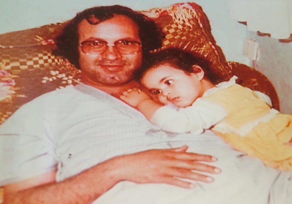 Omar Sayed holding Siham as a baby